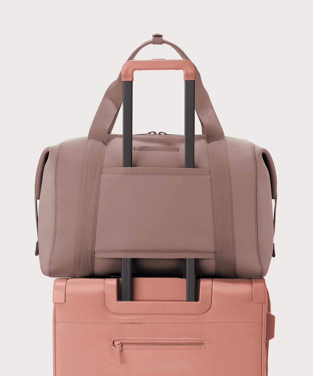 Extra large Landon Carryall in pink displaying luggage sleeve
