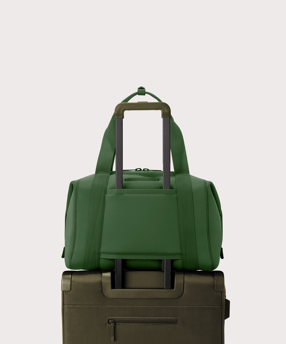 Large Landon Carryall in a rich, classic forest green displaying luggage sleeve
