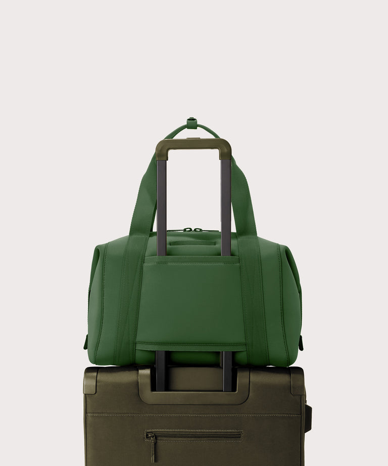 Large Landon Carryall in a rich, classic forest green displaying luggage sleeve

