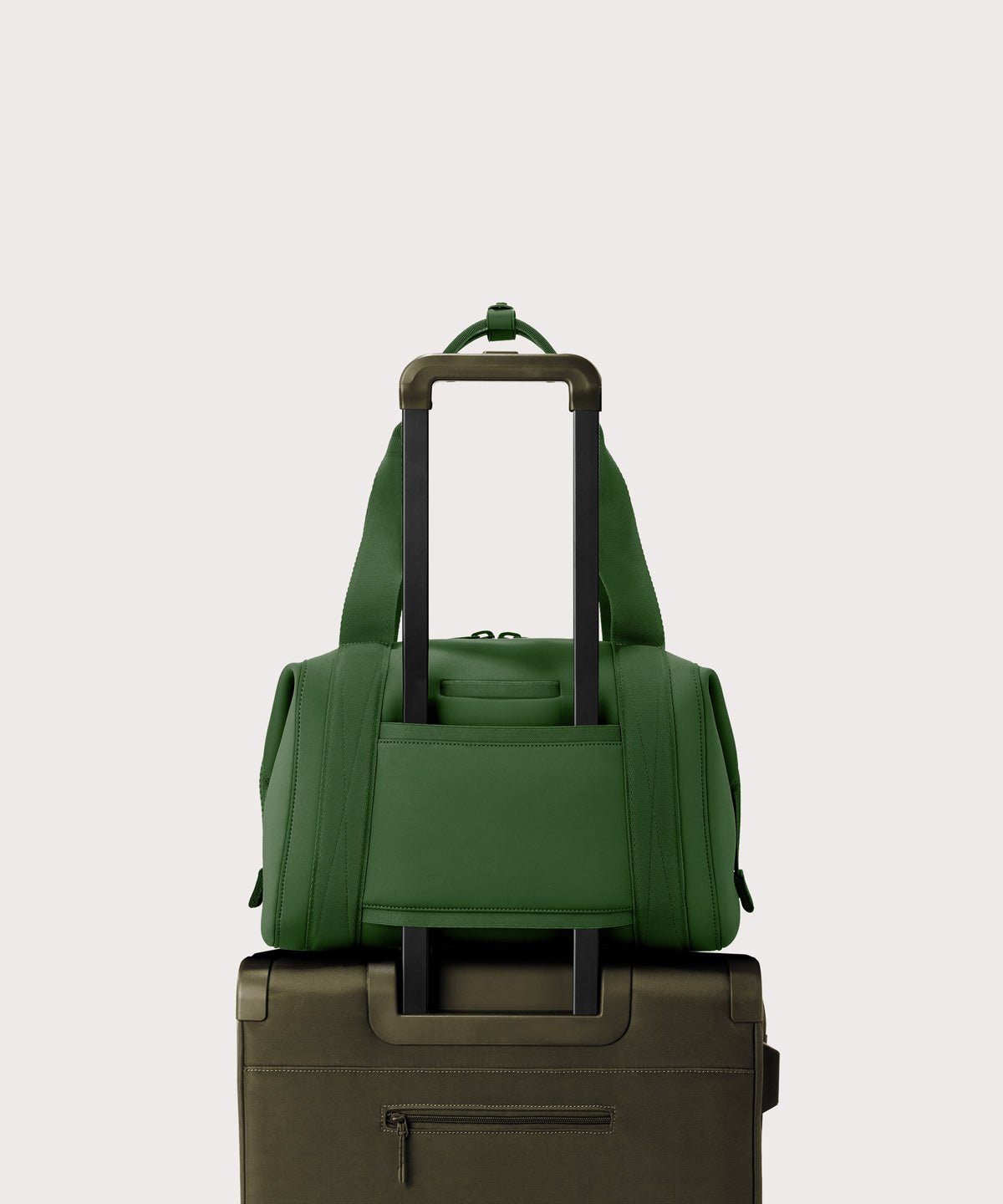 Large Landon Carryall in a rich, classic forest green. displaying luggage sleeve
