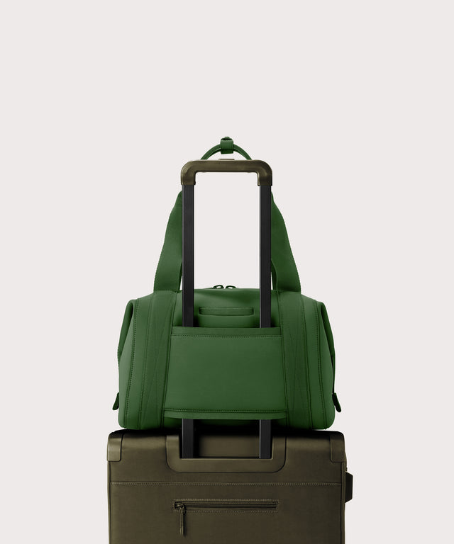 Large Landon Carryall in a rich, classic forest green. displaying luggage sleeve
