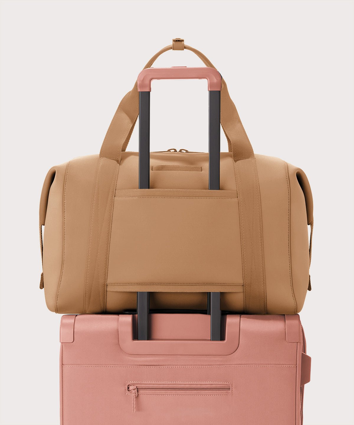 Extra large Landon Carryall in camel brown displaying luggage sleeve
