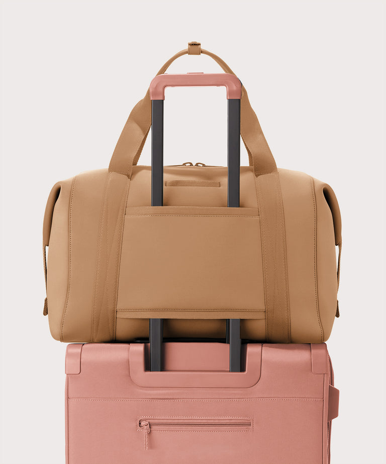 Extra large Landon Carryall in camel brown displaying luggage sleeve
