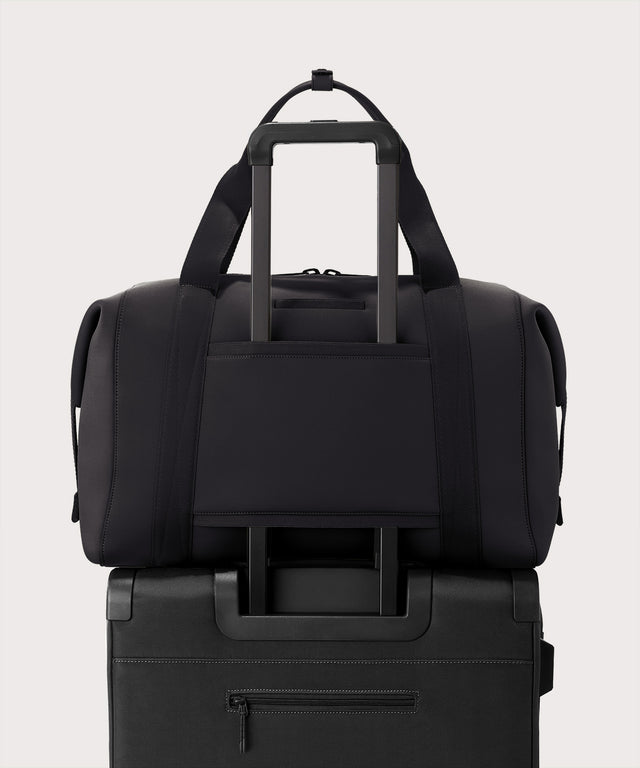 Extra large Landon Carryall in dark green displaying luggage sleeve
