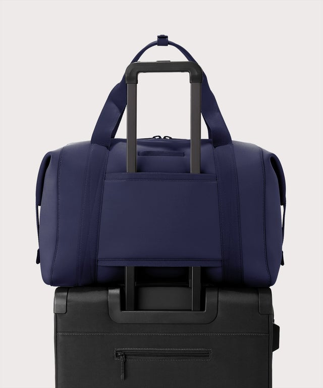 Extra large Landon Carryall in storm displaying luggage sleeve
