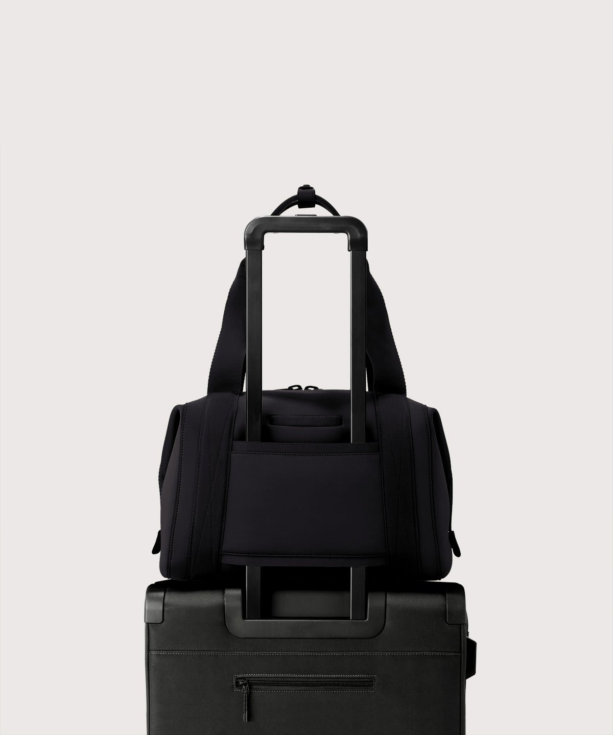Large Landon Carryall in black displaying luggage sleeve
