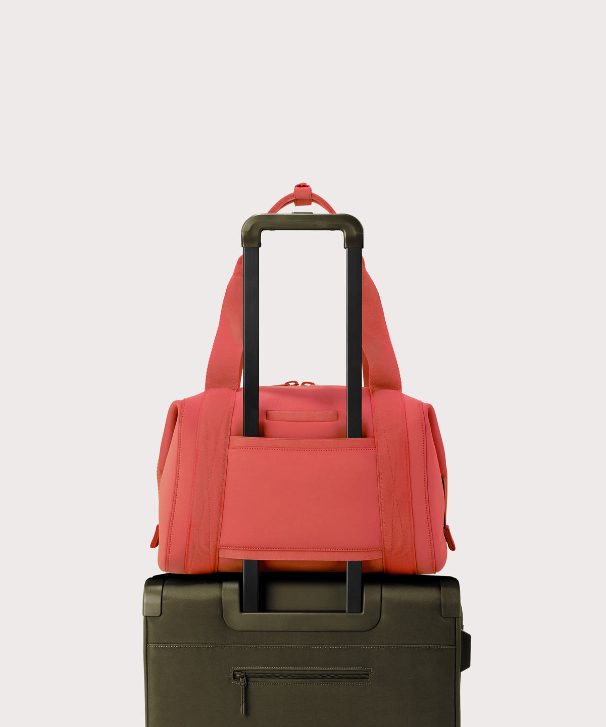 Large Landon Carryall in  a poppy, vintage wash red displaying luggage sleeve
