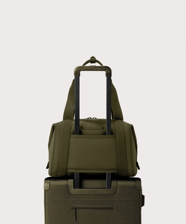 Large Landon Carryall in dark green displaying luggage sleeve

