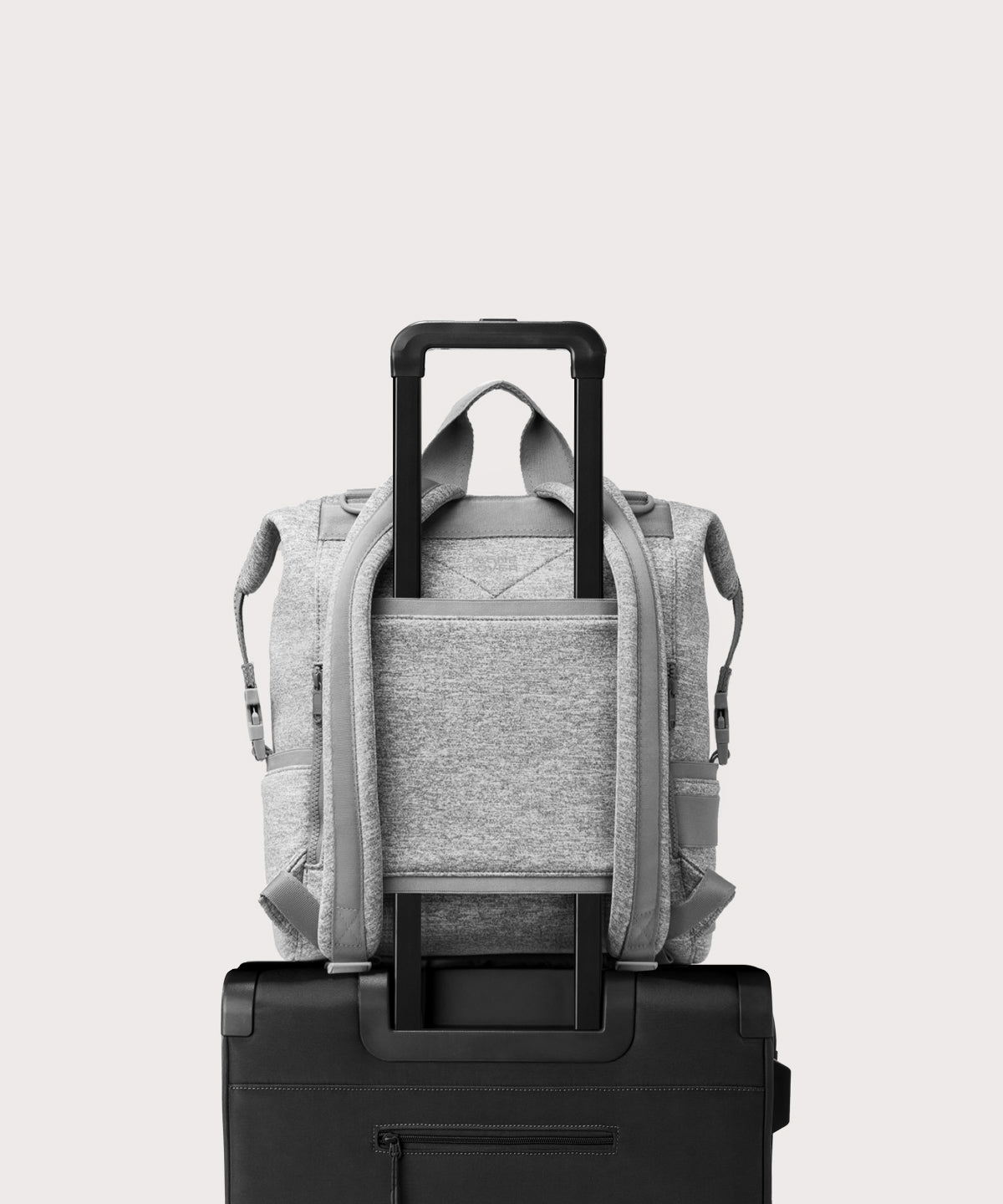 Dagne Dover Large Indi Diaper Backpack in grey showing the neoprene luggage sleeve.
