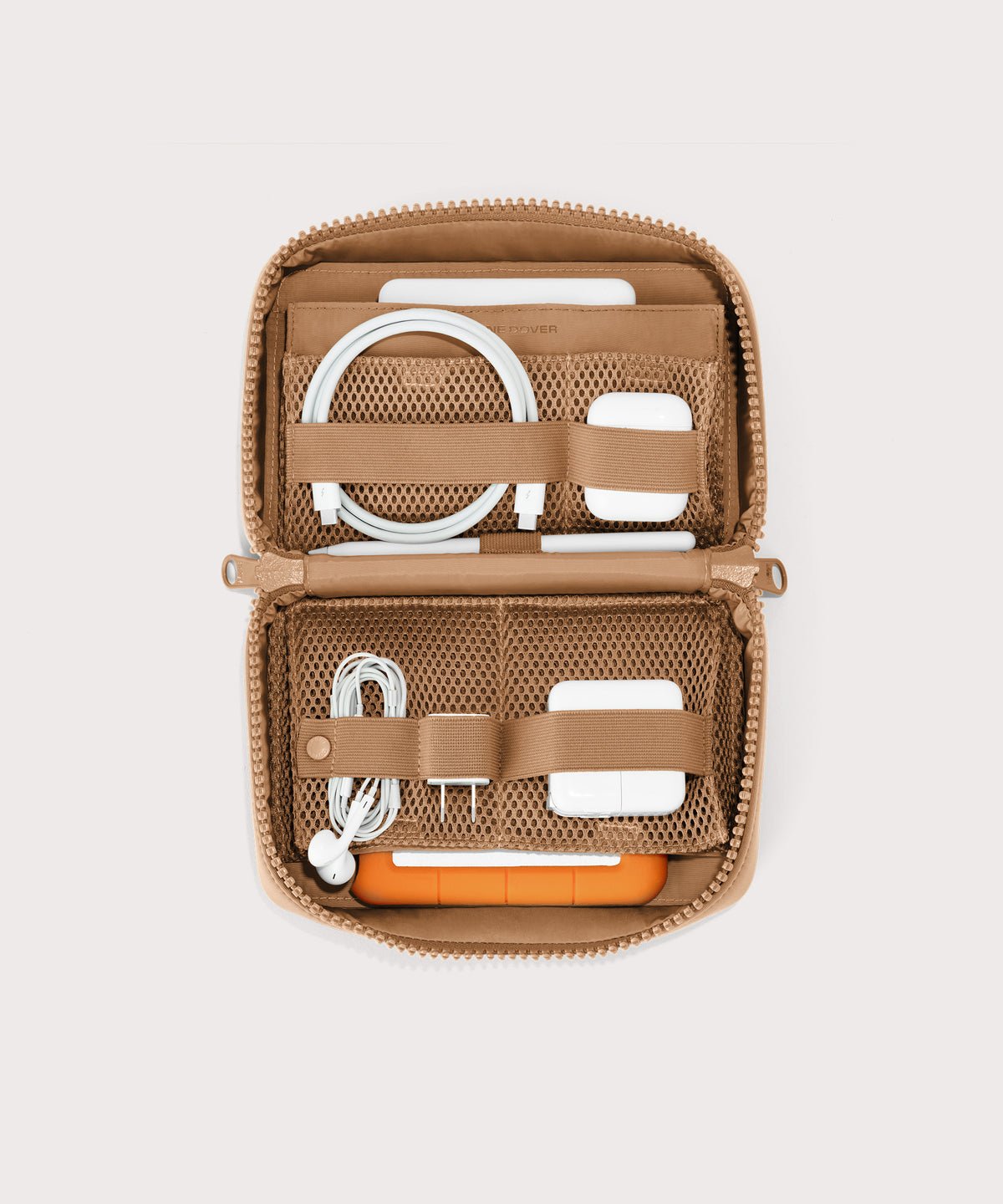 Dagne Dover large Arlo Tech Organizer in camel unzipped, revealing the interior elastic loops and airmesh pockets.