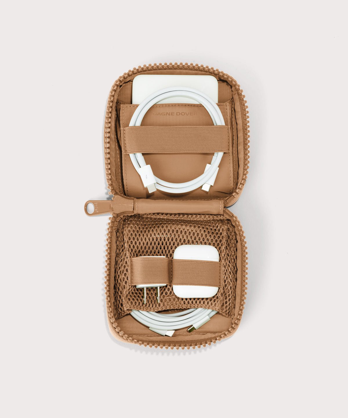 Dagne Dover small Arlo Tech Organizer in camel unzipped, revealing the interior elastic loops and airmesh pockets.