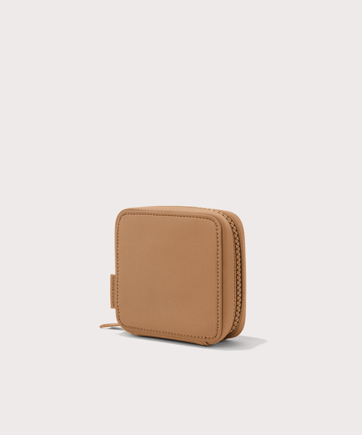 Dagne Dover small Arlo Tech Organizer in camel seen from an angle.
