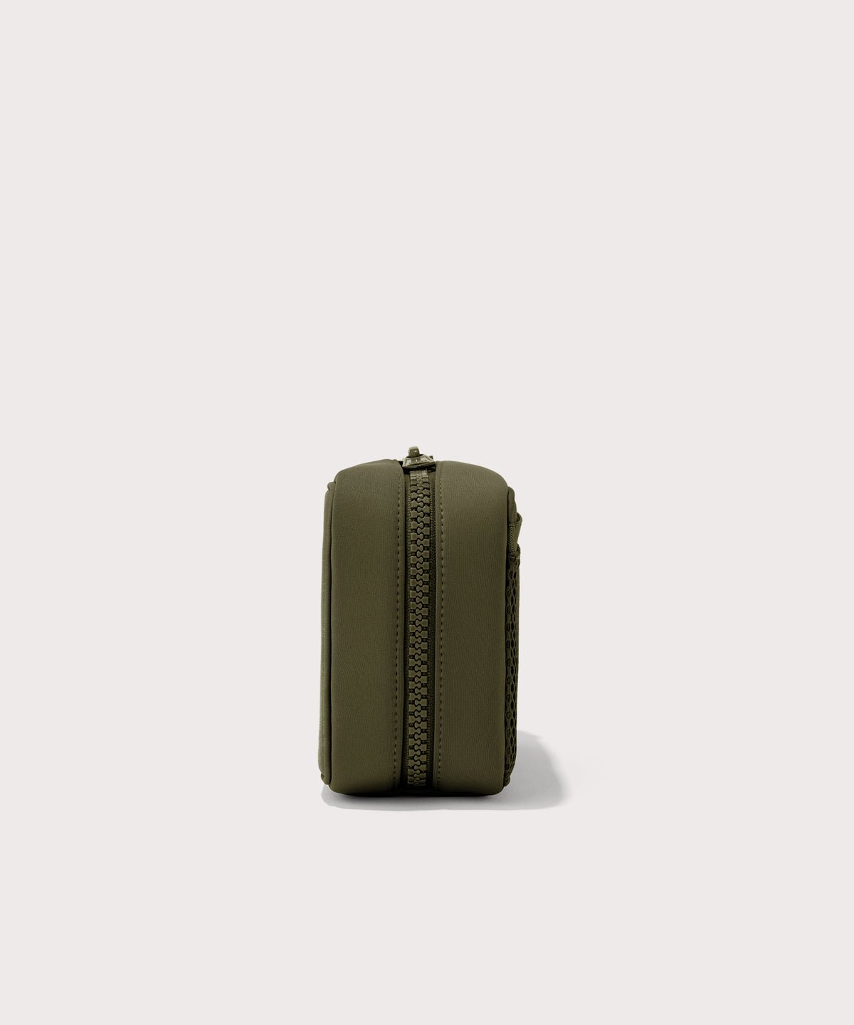 Dagne Dover large Arlo Tech Organizer in dark green seen from the side.
