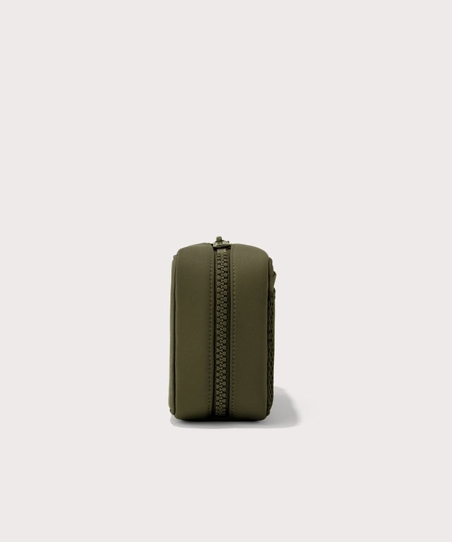 Dagne Dover large Arlo Tech Organizer in dark green seen from the side.
