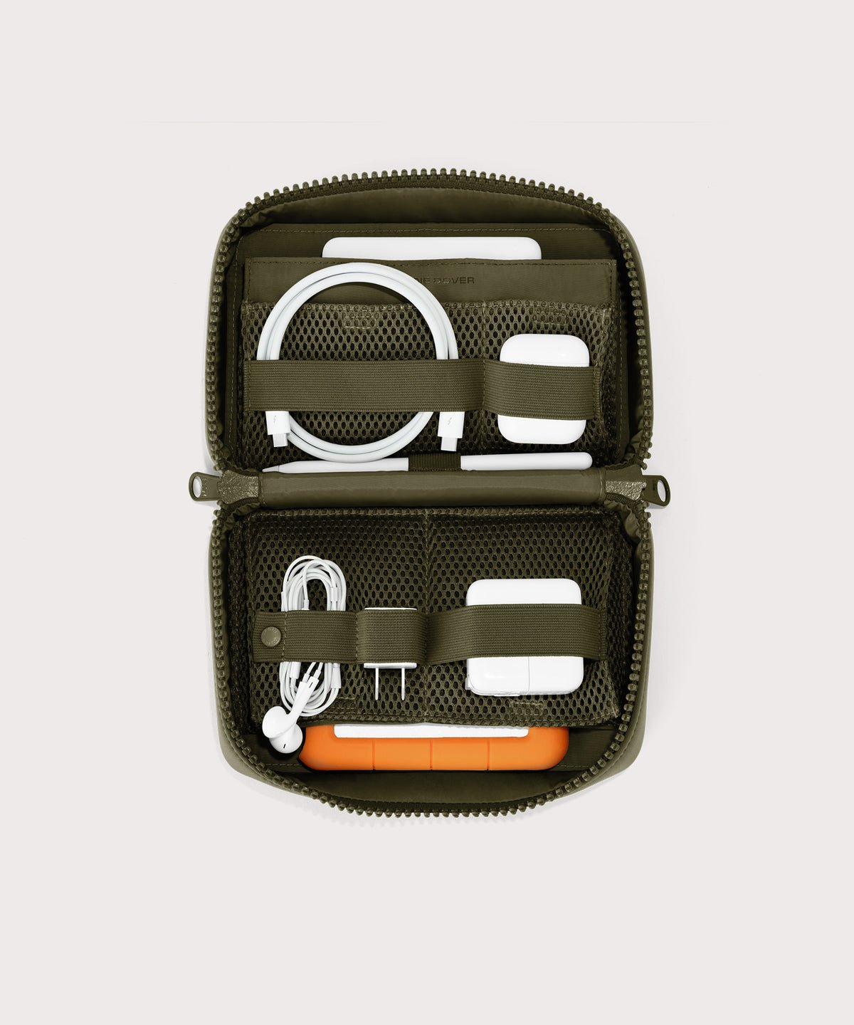 Dagne Dover large Arlo Tech Organizer in dark green unzipped, revealing the interior elastic loops and airmesh pockets.