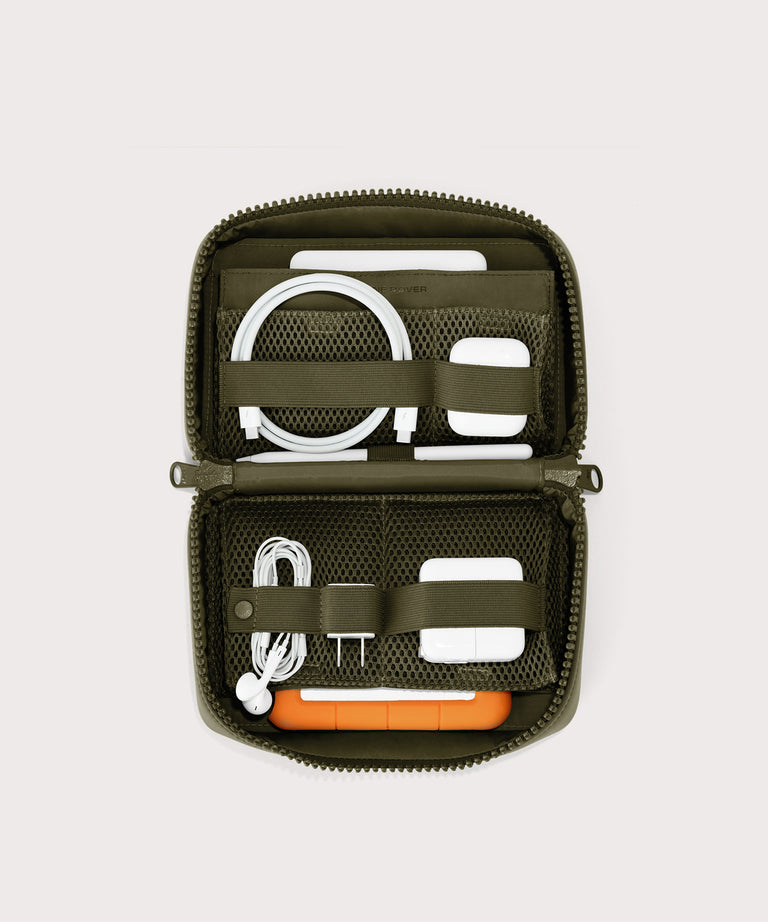hover - Dagne Dover large Arlo Tech Organizer in dark green unzipped, revealing the interior elastic loops and airmesh pockets.