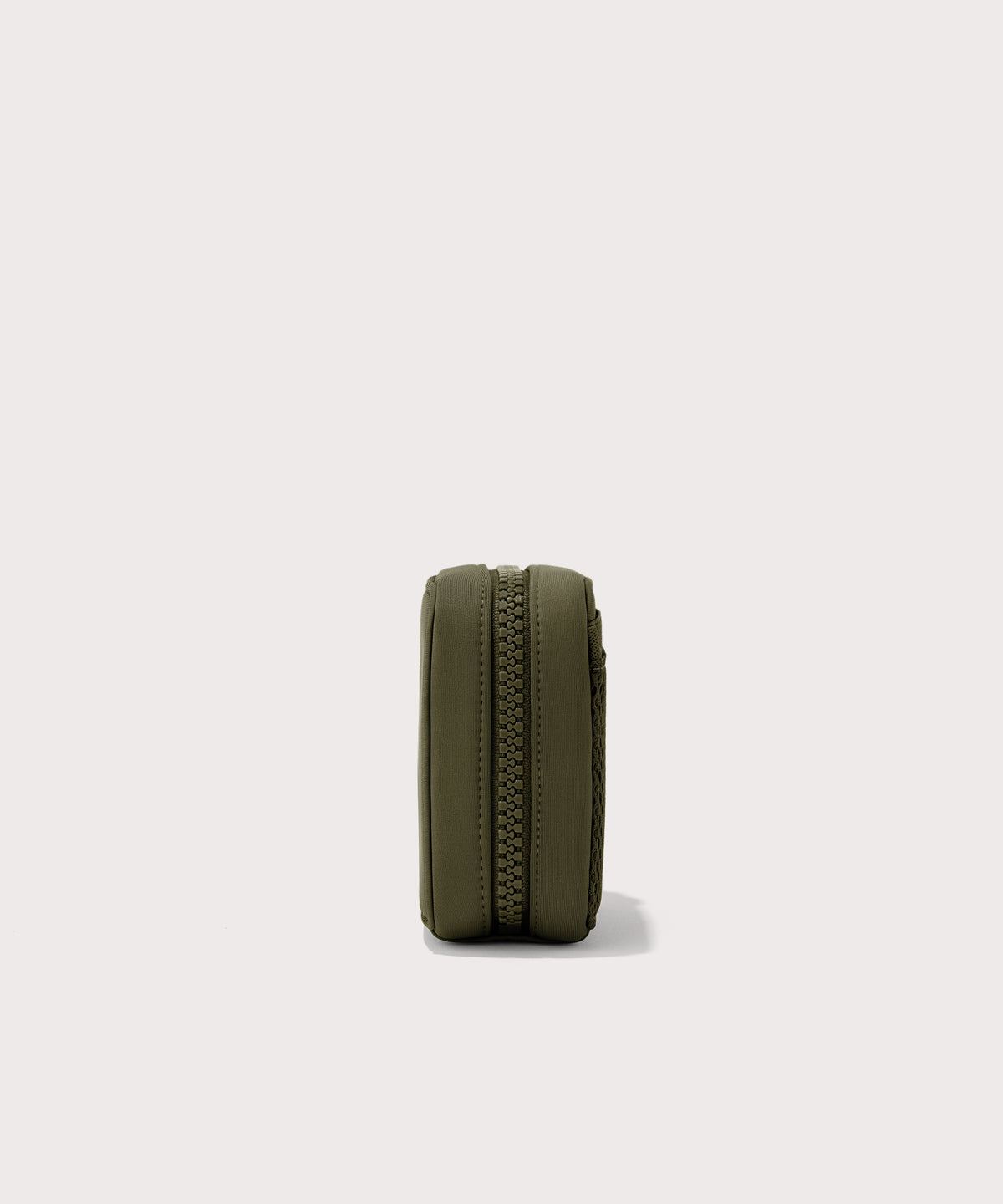 Dagne Dover small Arlo Tech Organizer in dark green seen from the side.
