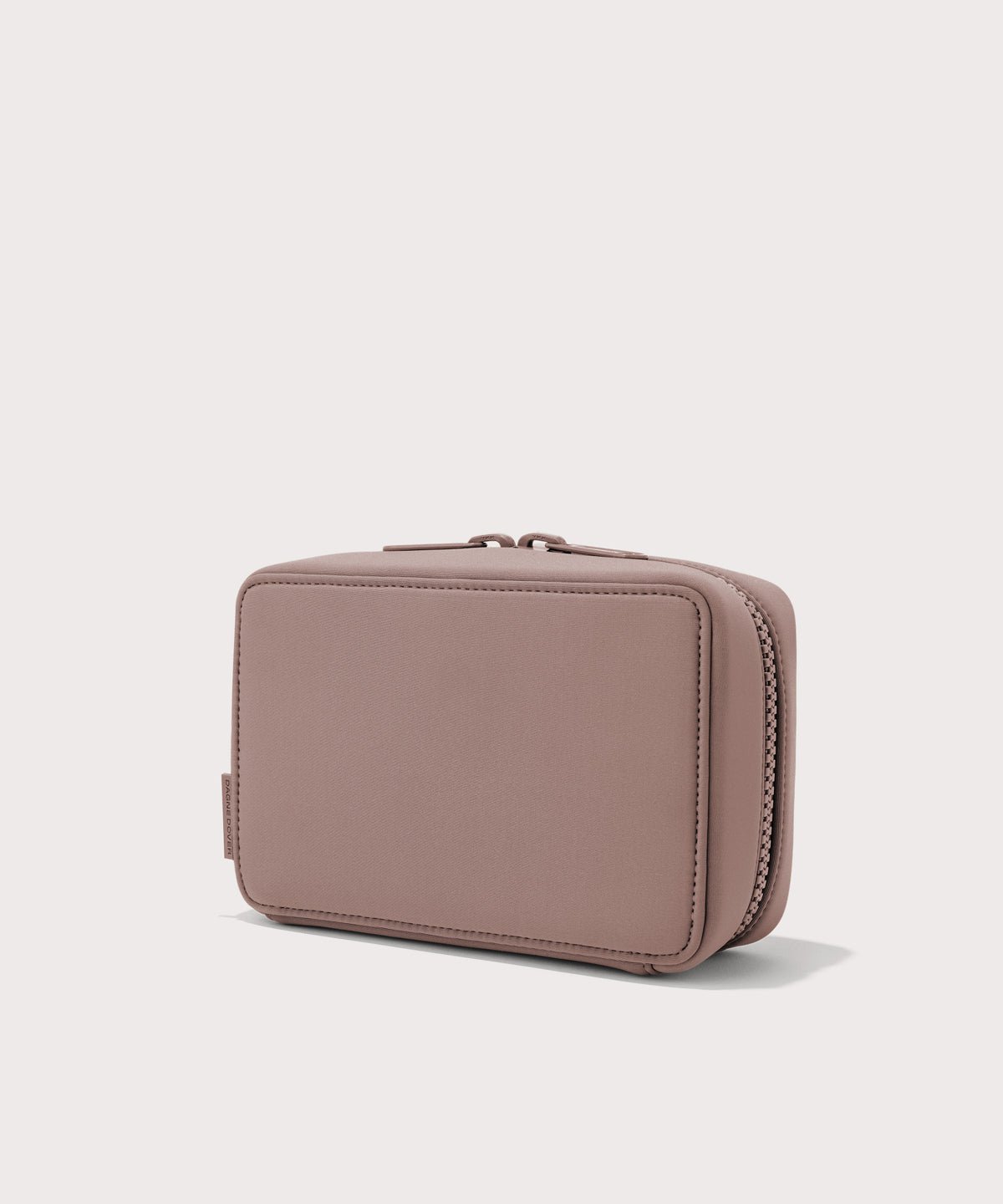 Dagne Dover large Arlo Tech Organizer in pink seen from an angle.
