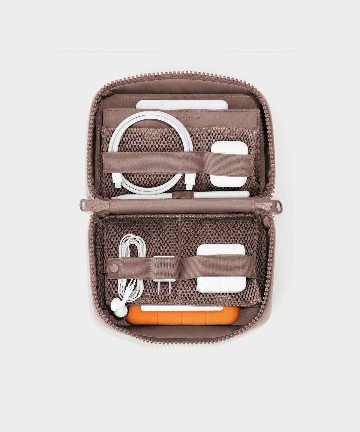Dagne Dover large Arlo Tech Organizer in pink unzipped, revealing the interior elastic loops and airmesh pockets.