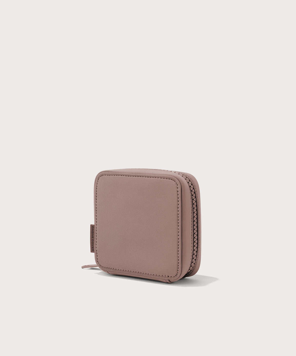 Dagne Dover small Arlo Tech Organizer in pink seen from an angle.
