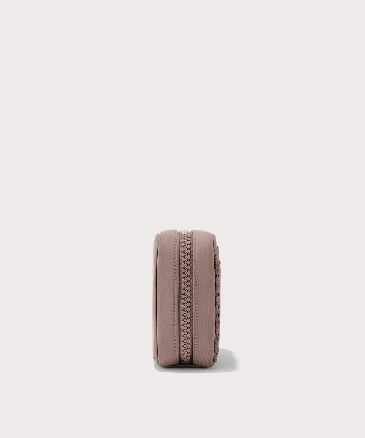 Dagne Dover small Arlo Tech Organizer in pink seen from the side.