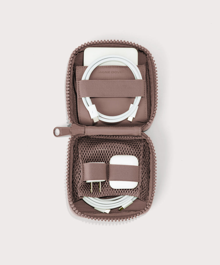 hover - Dagne Dover small Arlo Tech Organizer in pink unzipped, revealing the interior elastic loops and airmesh pockets.