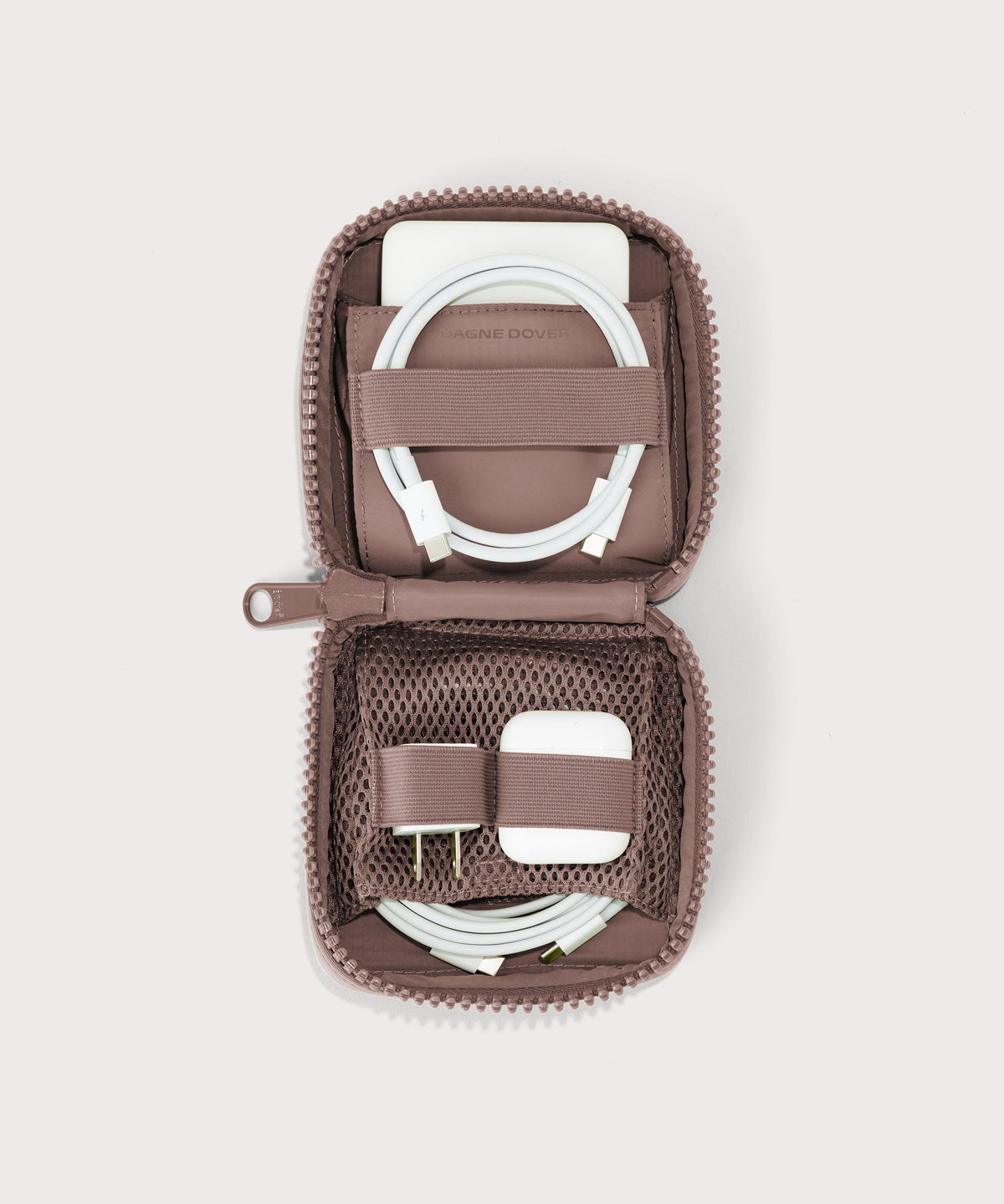 hover - Dagne Dover small Arlo Tech Organizer in pink unzipped, revealing the interior elastic loops and airmesh pockets.