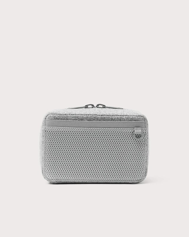 Dagne Dover large Arlo Tech Organizer in grey seen from the back.
