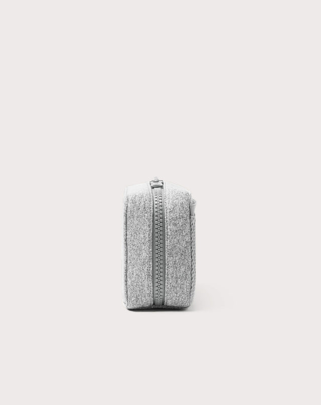 Dagne Dover large Arlo Tech Organizer in grey seen from the side.

