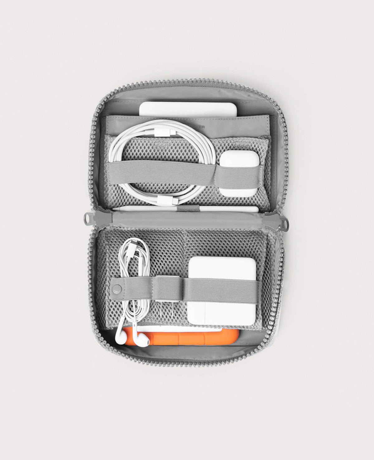 Dagne Dover large Arlo Tech Organizer in grey unzipped, revealing the interior elastic loops and airmesh pockets.
