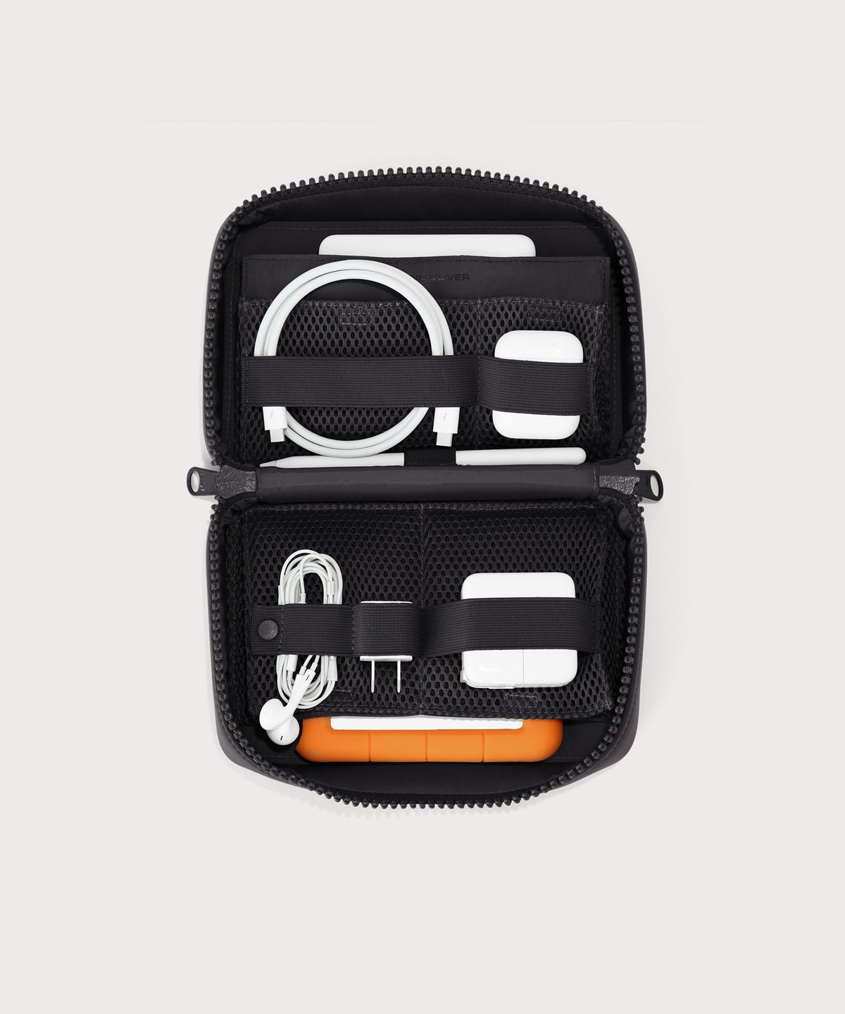 Dagne Dover large Arlo Tech Organizer in black unzipped, revealing the interior elastic loops and airmesh pockets.