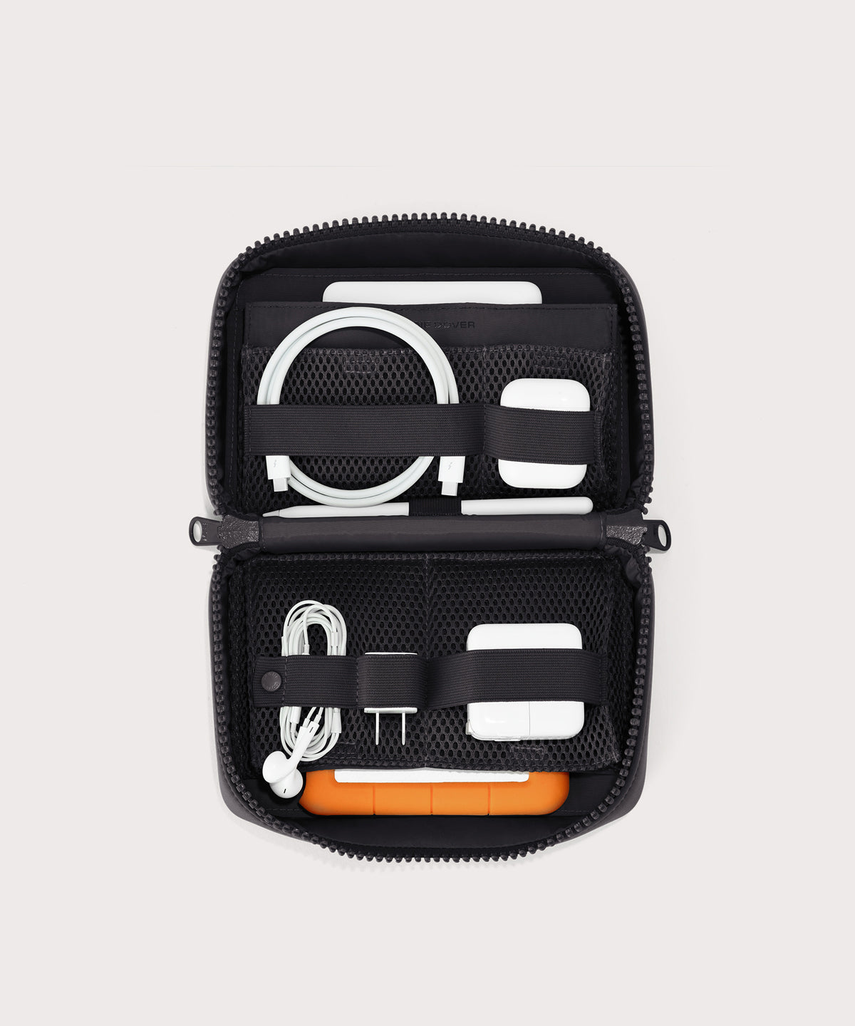 hover - Dagne Dover large Arlo Tech Organizer in black unzipped, revealing the interior elastic loops and airmesh pockets.