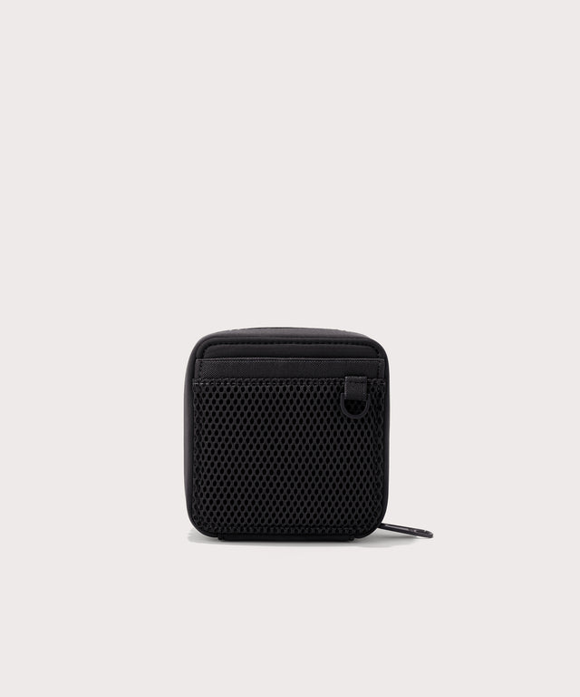 Dagne Dover small Arlo Tech Organizer in black seen from the back.
