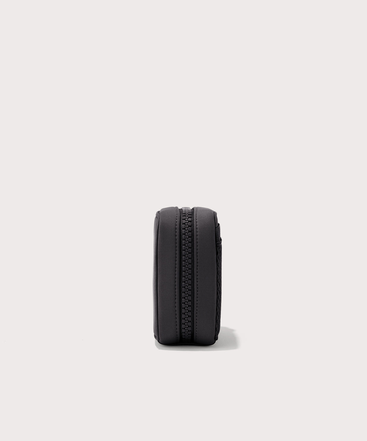 Dagne Dover small Arlo Tech Organizer in black seen from the side.
