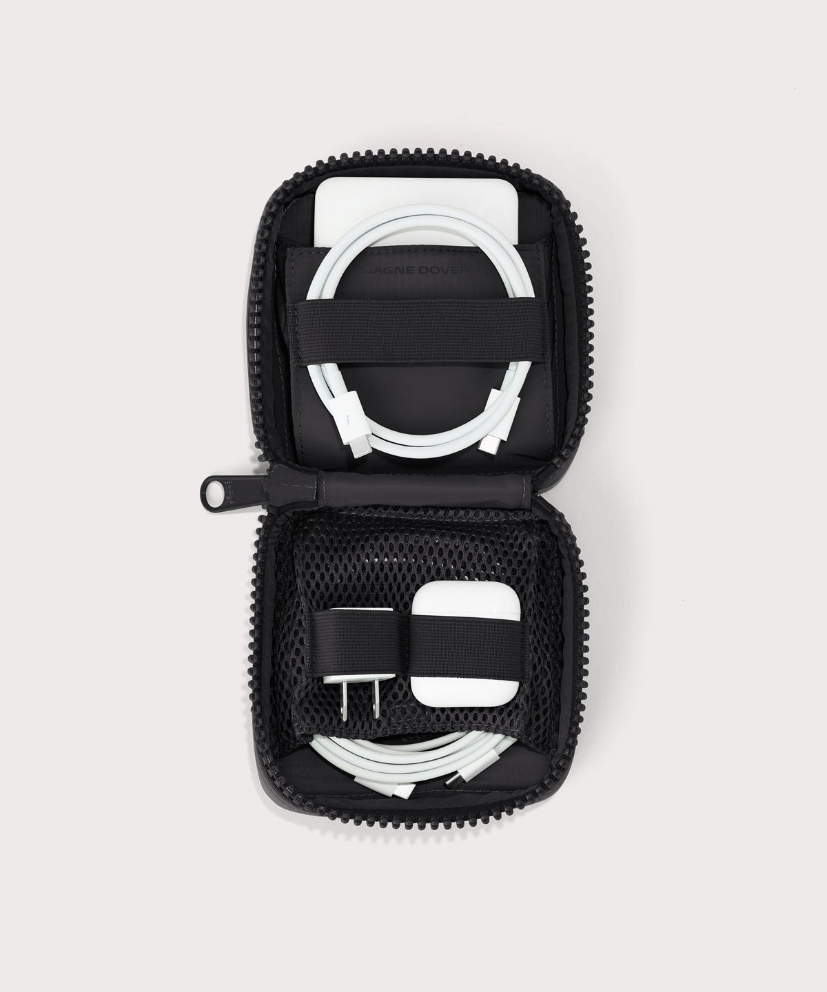 Dagne Dover small Arlo Tech Organizer in black unzipped, revealing the interior elastic loops and airmesh pockets.