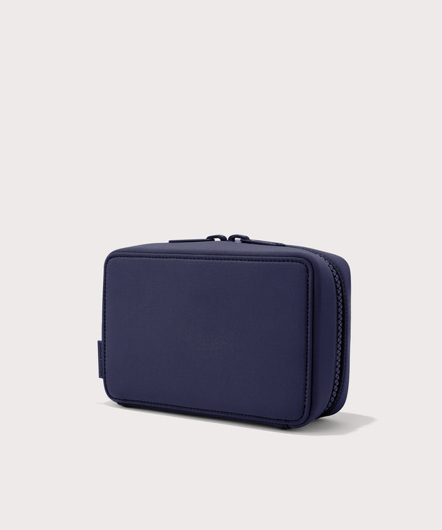 Dagne Dover large Arlo Tech Organizer in dark blue seen from an angle.
