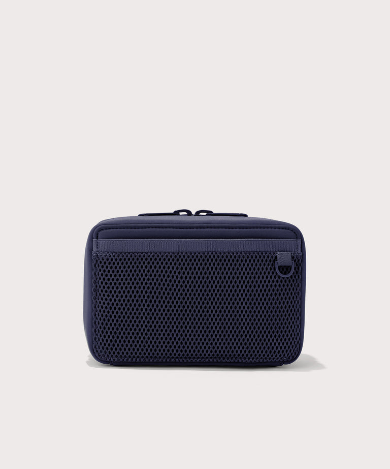 Dagne Dover large Arlo Tech Organizer in dark blue seen from the back.
