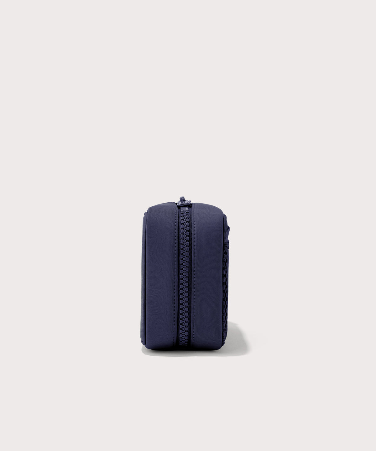 Dagne Dover large Arlo Tech Organizer in dark blue seen from the side.
