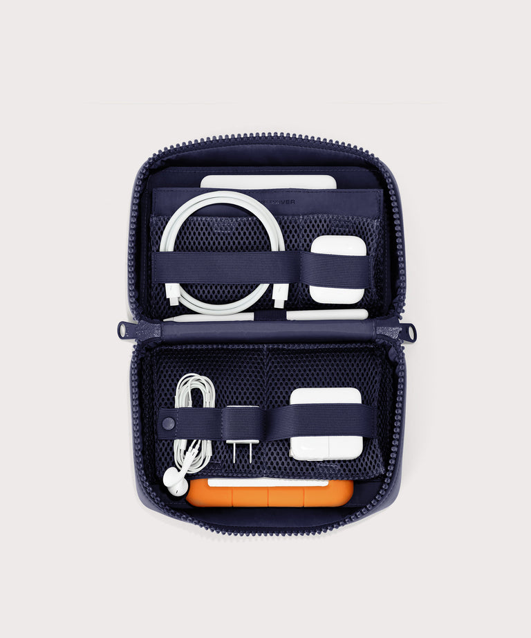 hover - Dagne Dover large Arlo Tech Organizer in dark blue unzipped, revealing the interior elastic loops and airmesh pockets.