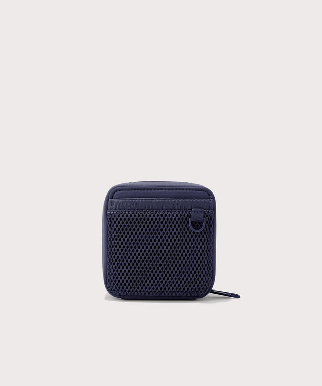 Dagne Dover small Arlo Tech Organizer in  dark blue seen from the back.
