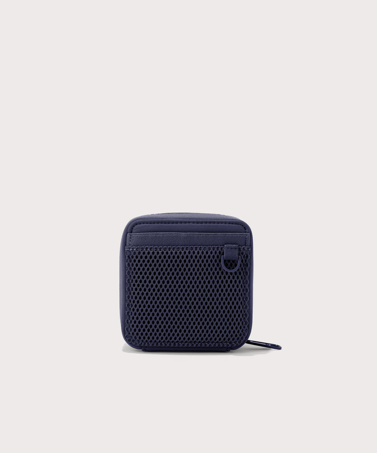Dagne Dover small Arlo Tech Organizer in  dark blue seen from the back.
