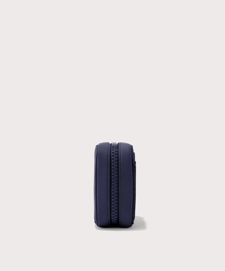 Dagne Dover small Arlo Tech Organizer in  dark blue seen from the side.
