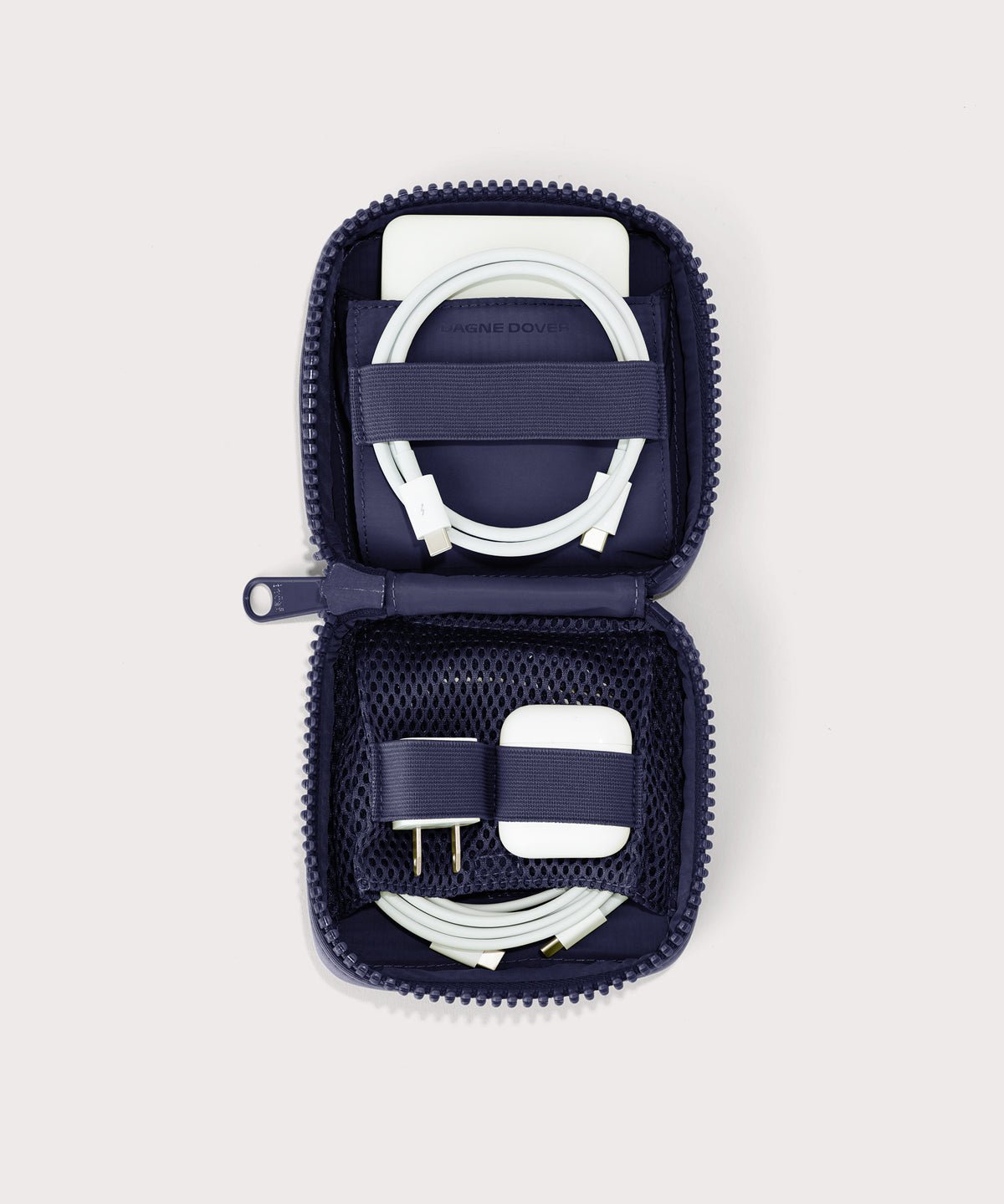 Dagne Dover small Arlo Tech Organizer in  dark blue unzipped, revealing the interior elastic loops and airmesh pockets.