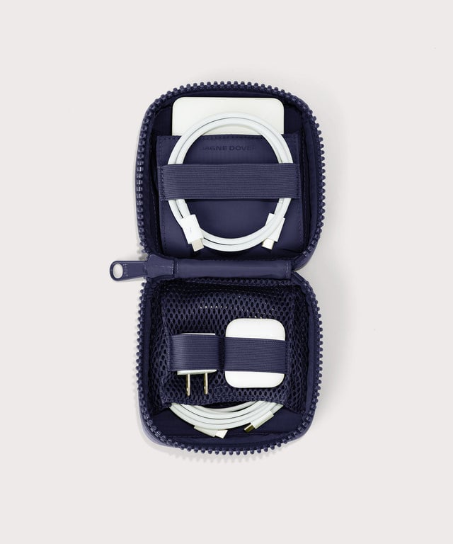 Dagne Dover small Arlo Tech Organizer in  dark blue unzipped, revealing the interior elastic loops and airmesh pockets.