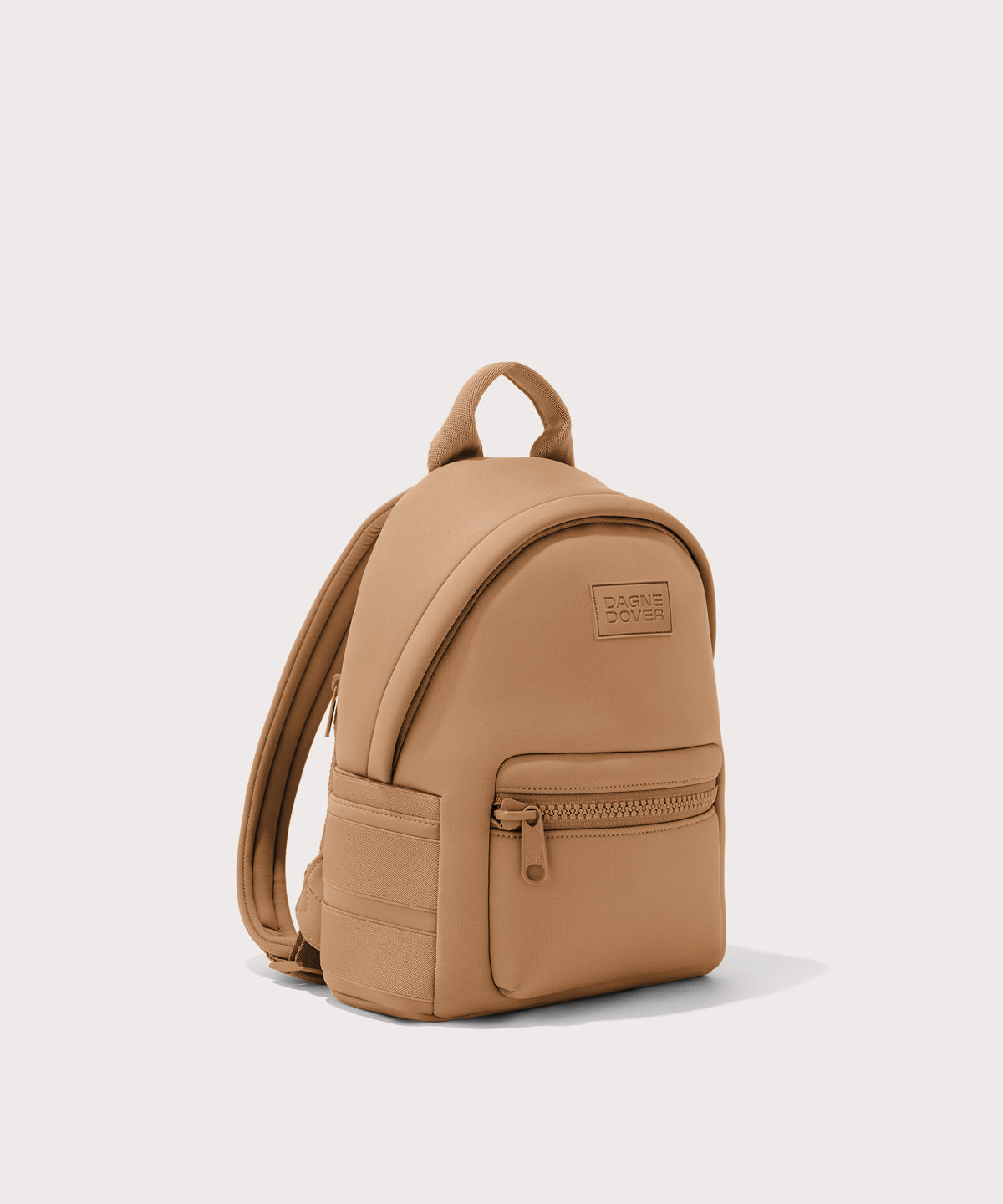 Dagne Dover small Dakota Neoprene Backpack in camel seen from an angle.
