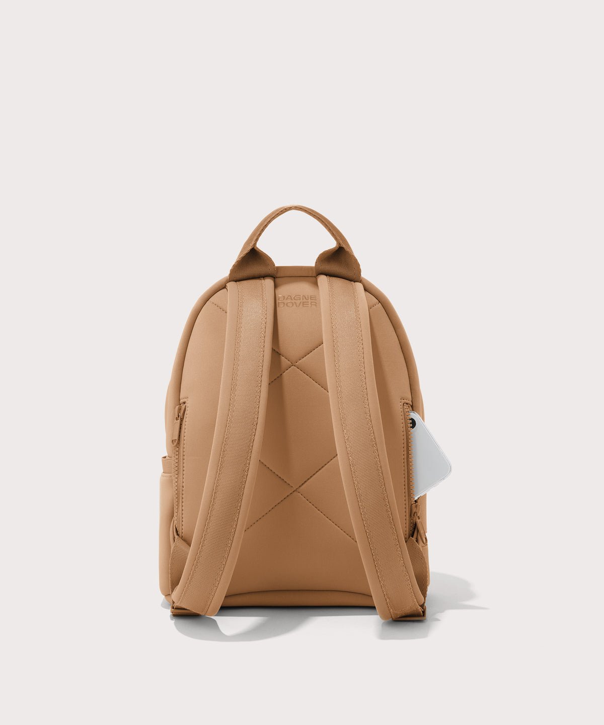 Dagne Dover small Dakota Neoprene Backpack in camel seen from the back.
