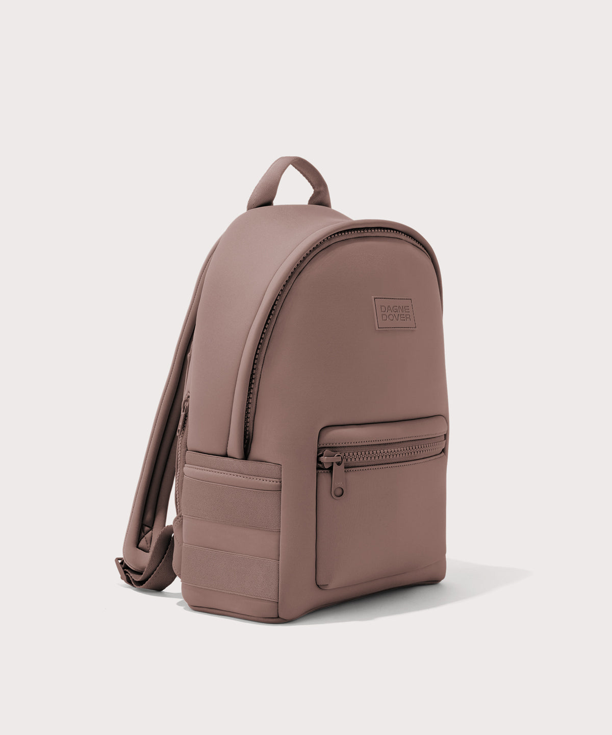 Dagne Dover medium Dakota Neoprene Backpack in pink seen from an angle.
