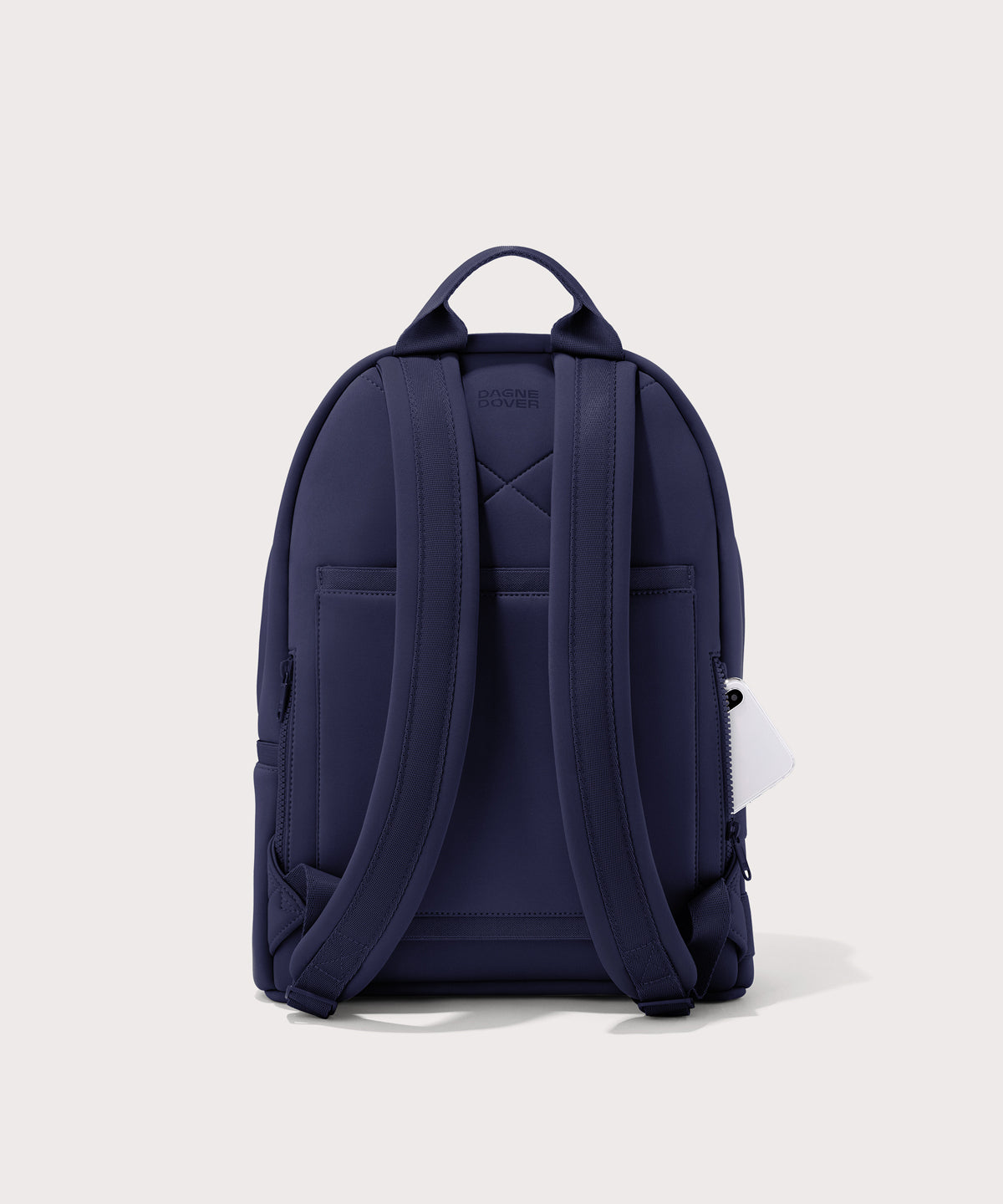 Dagne Dover medium Dakota Neoprene Backpack in dark blue seen from the back.
