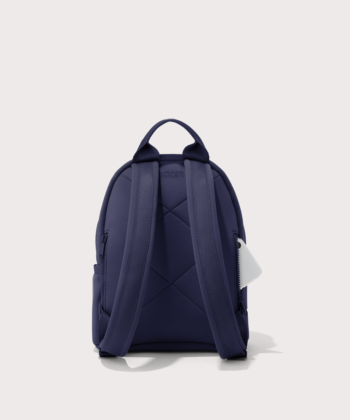Dagne Dover small Dakota Neoprene Backpack in dark blue seen from the back.
