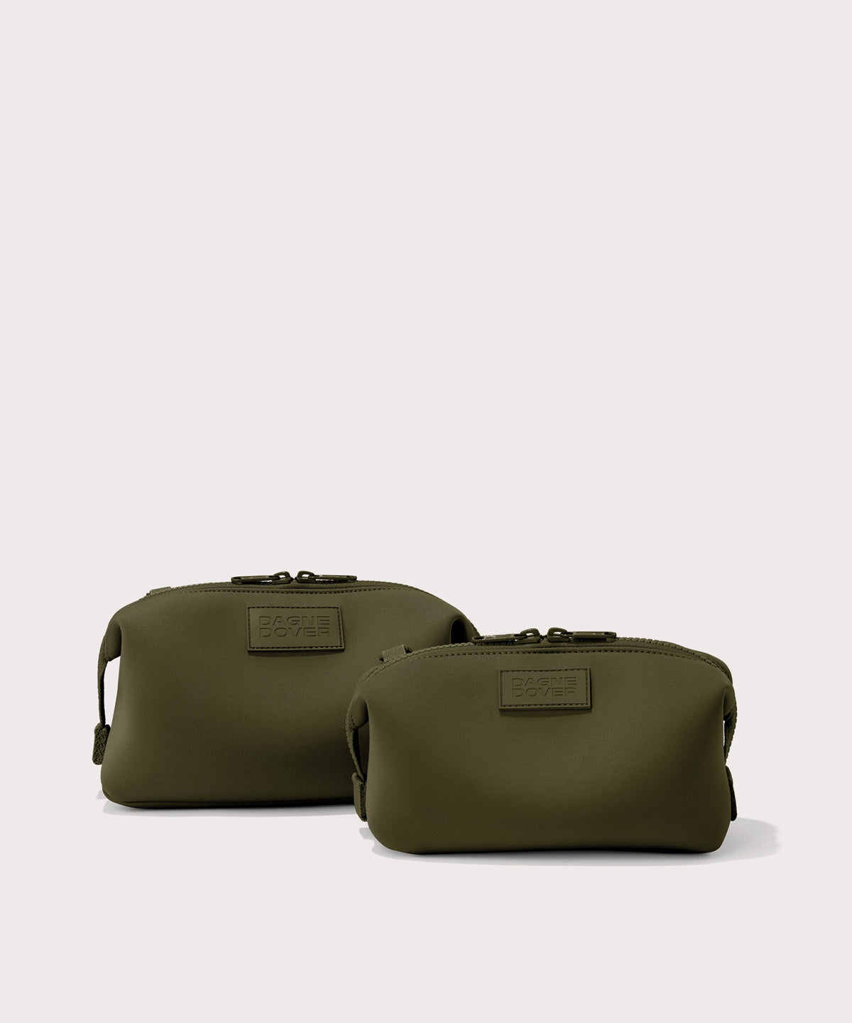 Dagne Dover Small and Large Hunter Toiletry Bags in dark moss.
